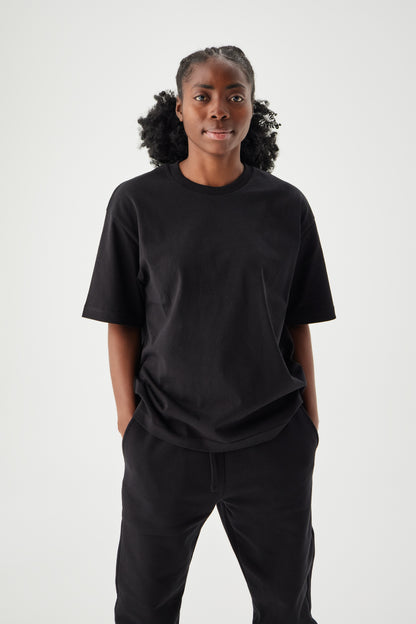 Women wearing black boxy t-shirt front view