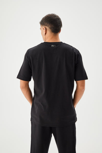 Men wearing regular black t-shirt full back view