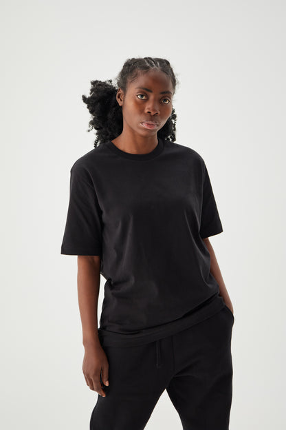 Women wearing regular black t-shirt front view